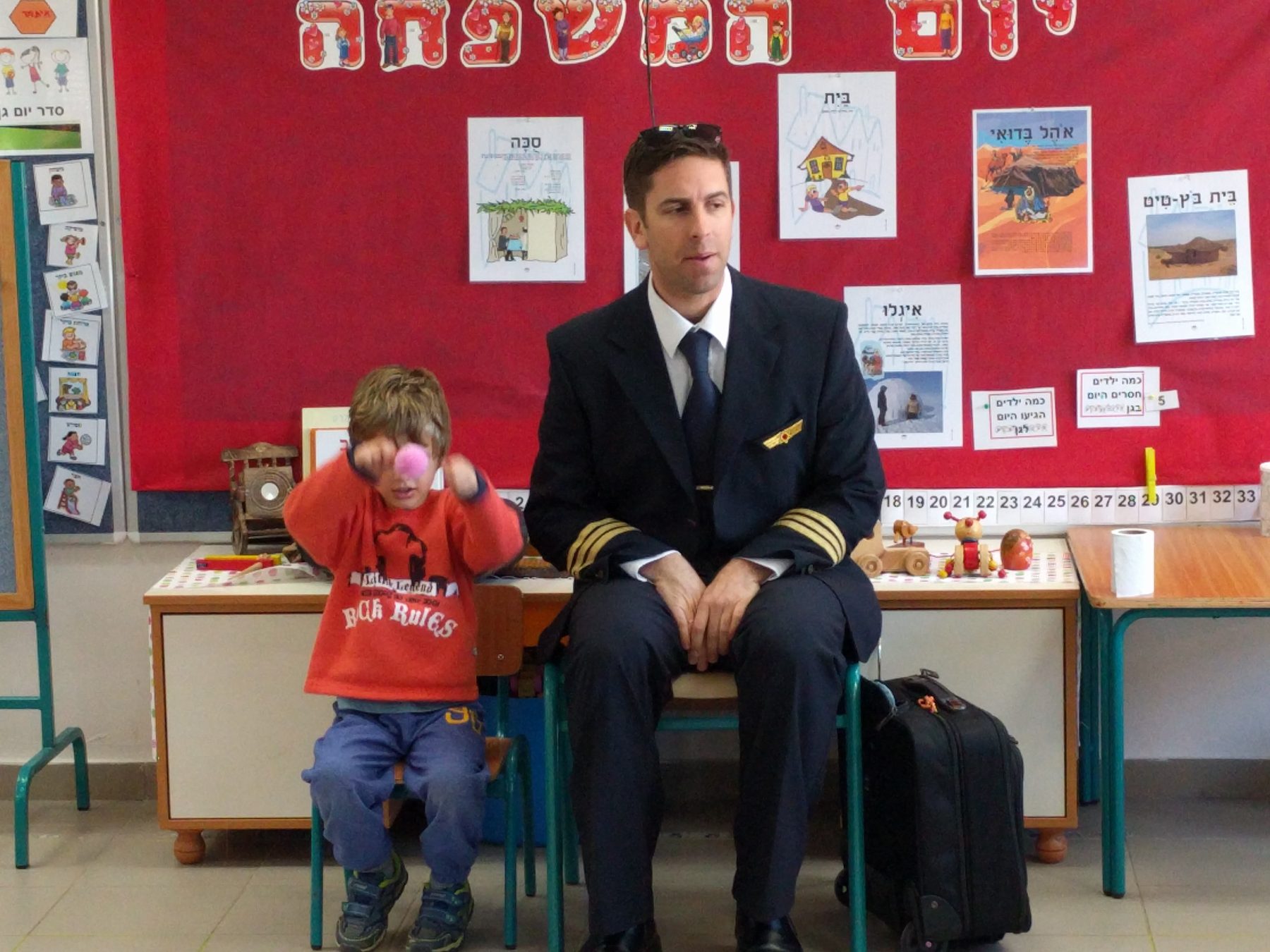 Elad visiting a classroom during Hanukkah
