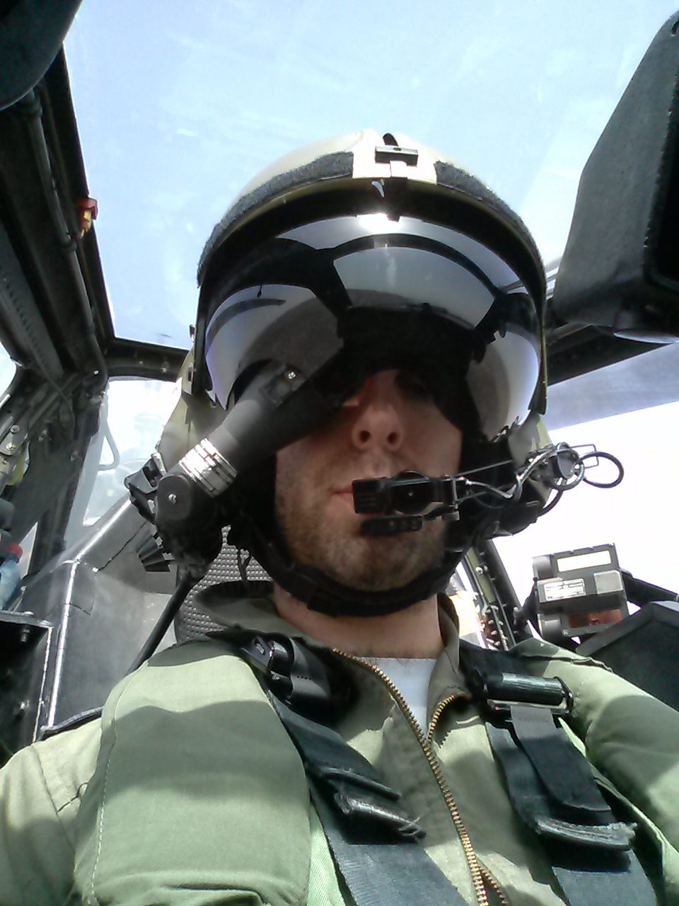 Elad Rothschild in an Apache helicopter cockpit, visor down